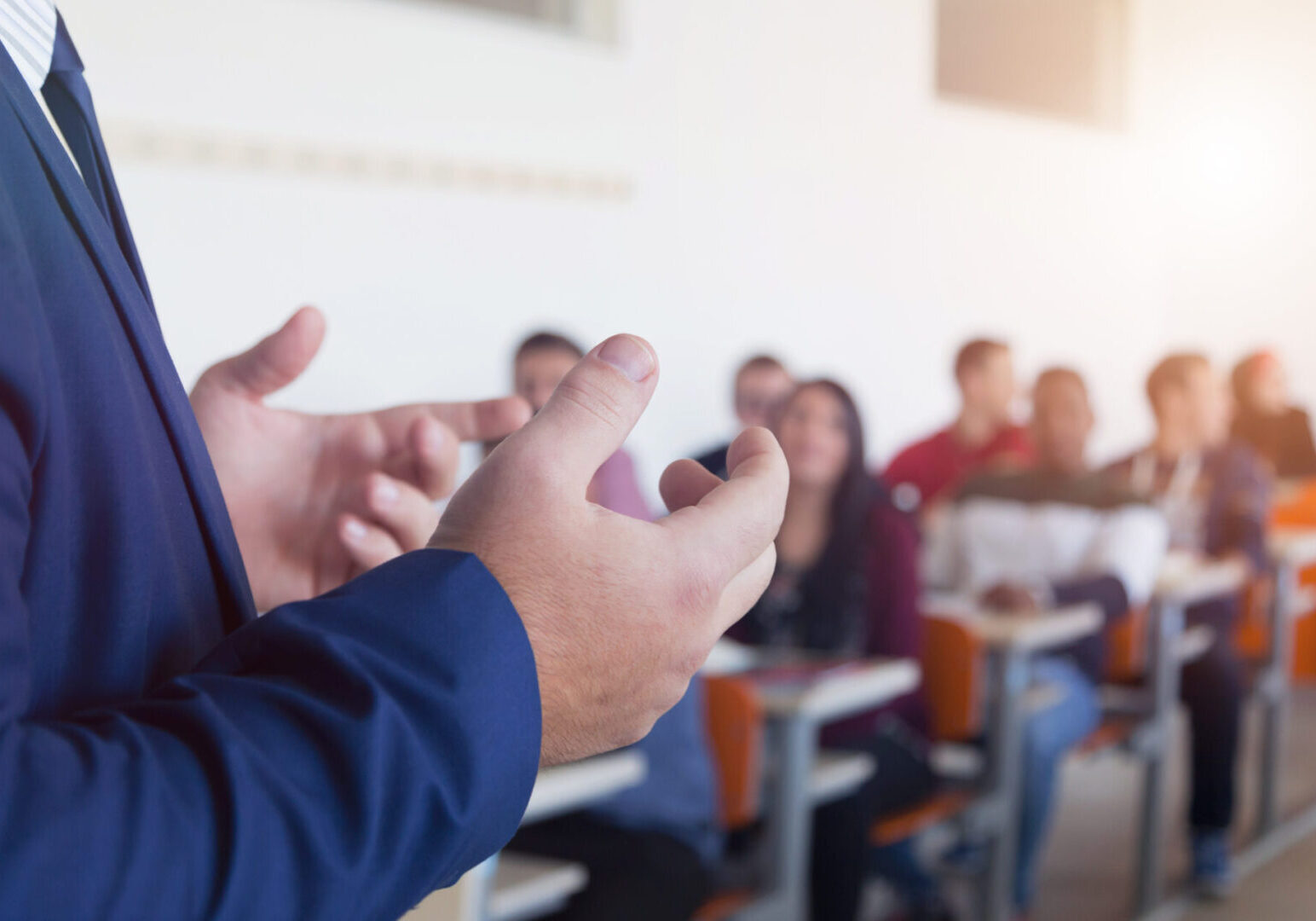 A group of people sitting in front of each other.